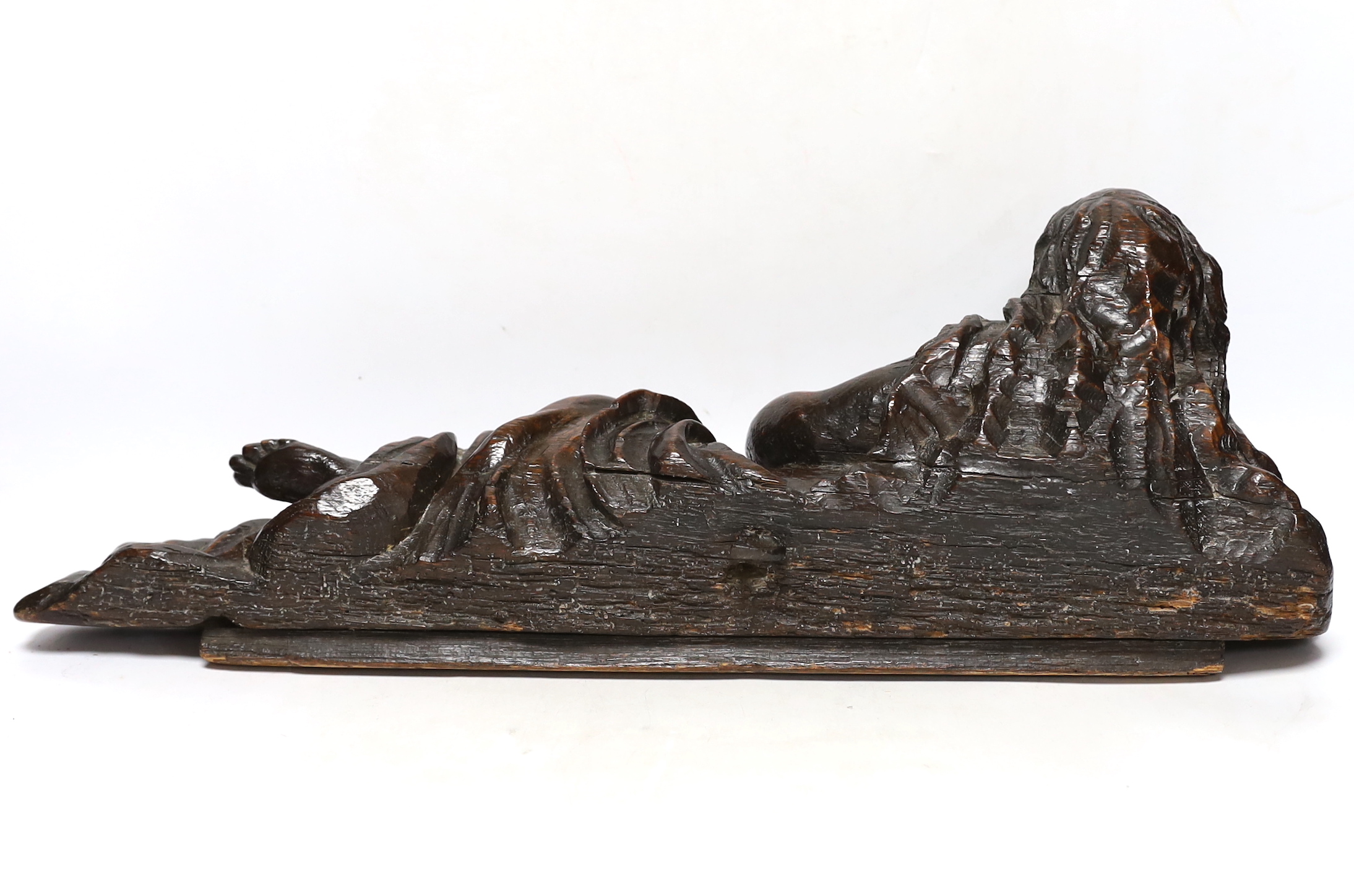A 17th century carved oak figure of the penitent Mary Magdalene, possibly English, 52.5cm